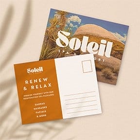 Two postcards, one with a crisp image on the front and the other with a space on the back for a sender's address with business branding.