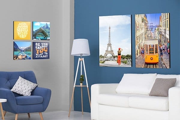 Custom photo posters, depicting positive sayings and cities around the world, transform a plain room into an inviting and positive space.