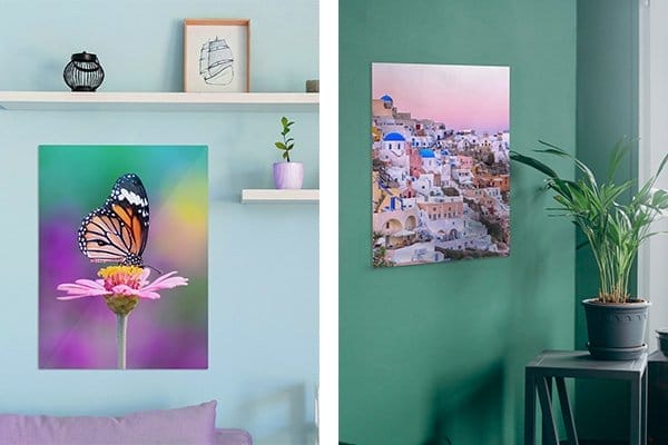 Two custom metal prints hang on the wall. One pictures a butterfly, the other an Italian coastal neighborhood.