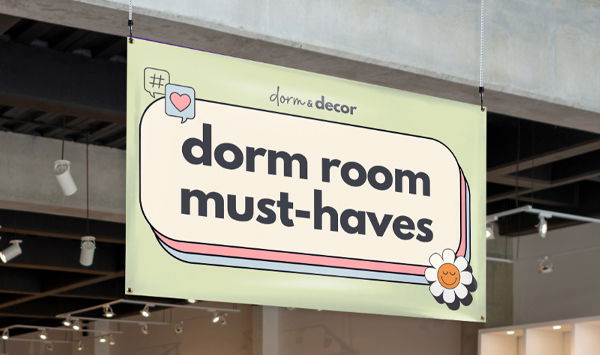 A vibrant indoor banner hangs inside a store that reads “dorm room must-haves.”