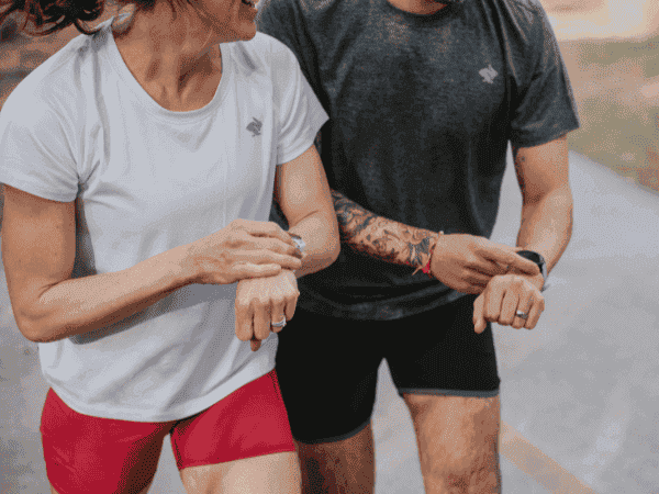 Man and woman wearing Garmin watches