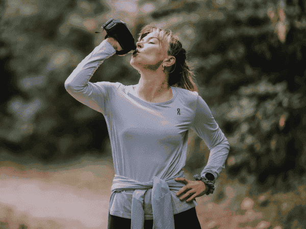 Woman drinking from a water bottle