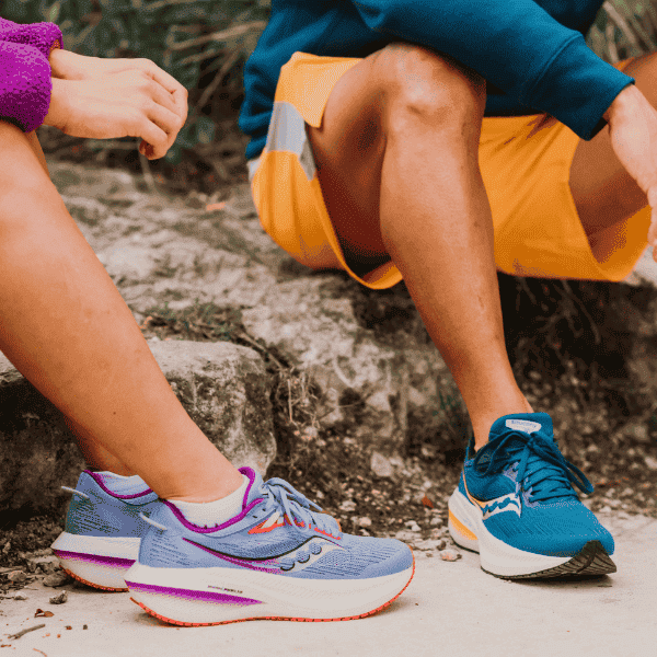 Man and woman wearing Saucony Triumph 21 shoes