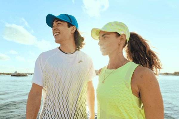 Man and woman wearing Brooks apparel