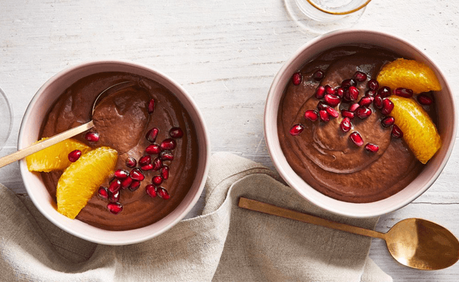 Jeweled Avocado-Chocolate Pudding garnished with pomegranate seeds and orange segments