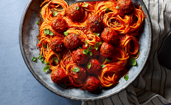 Spaghetti Marinara with Meatballs on a blue plate