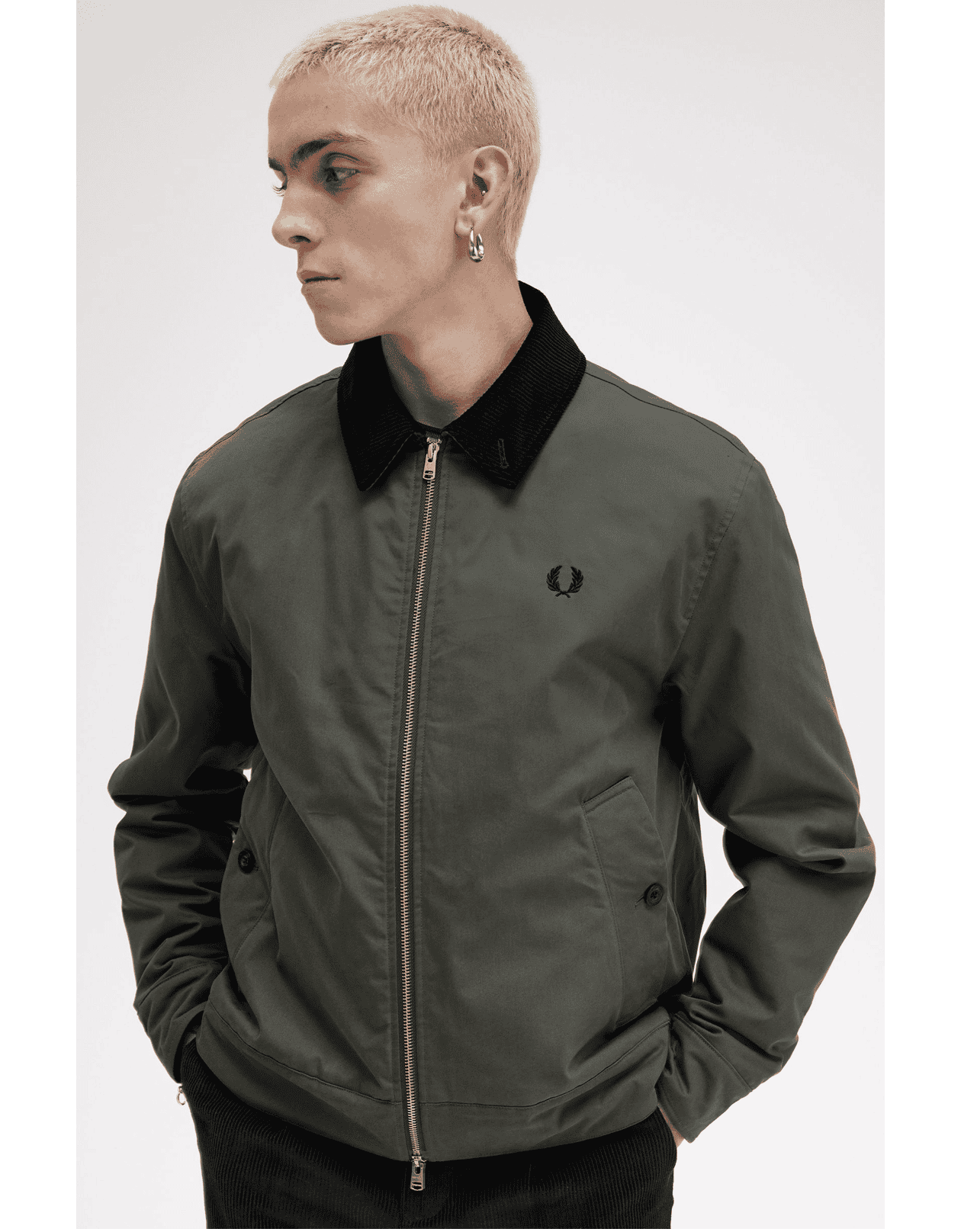 Male model wearing a lightweight Fred Perry Jacket 