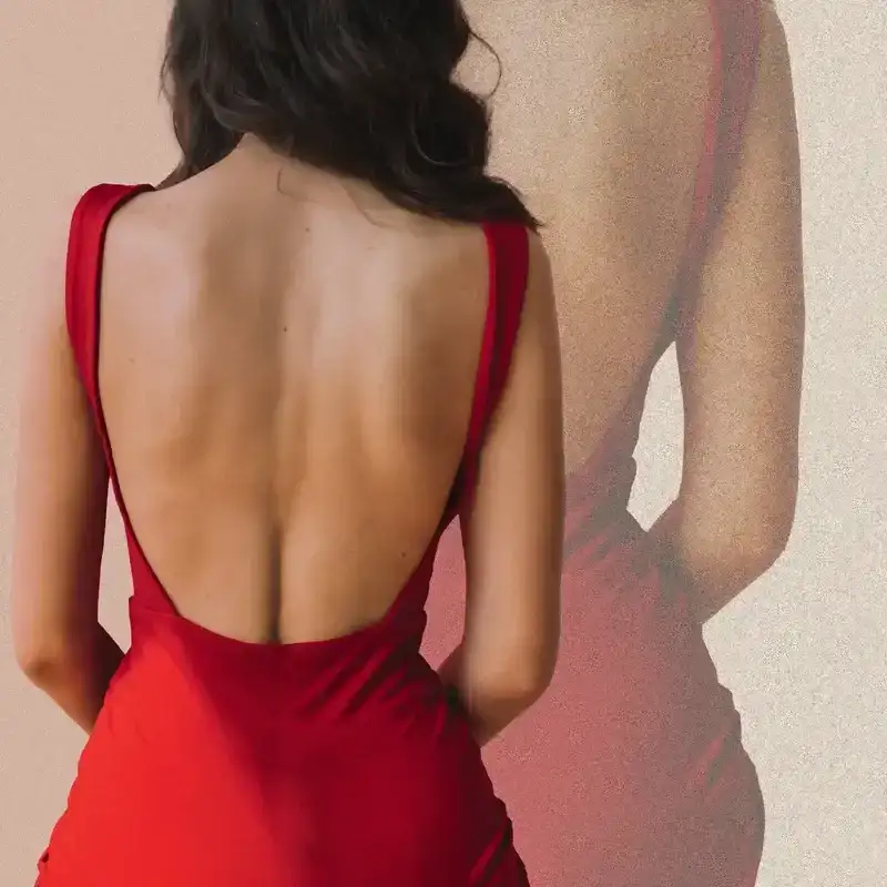 Woman wearing red backless dress