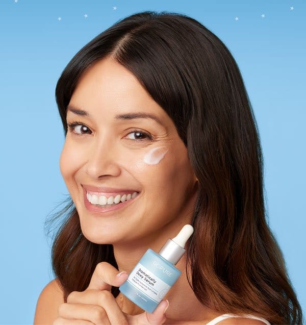 Woman holding Dramatically Dewy Serum