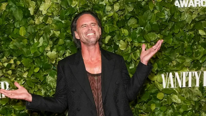 Image may contain: Walton Goggins, Face, Happy, Head, Person, Adult, Accessories, Jewelry, Necklace, Plant, and Vegetation