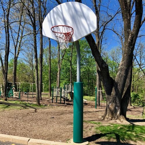 green safety pole pad on basketball pole
