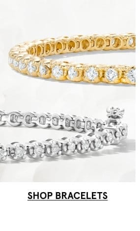 Image of yellow gold and white gold diamond bracelets. Click SHOP BRACELETS >