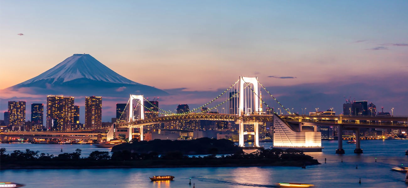 Urban sunset view with Rainbow bridge and Mount Fuji, Tokyo Odaiba, Japan.