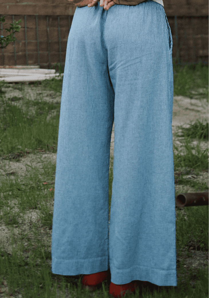 close back view of blue striped linen pants.