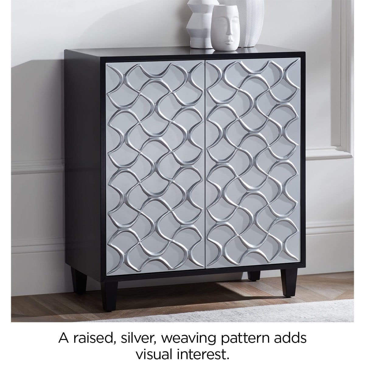 A raised, silver, weaving pattern adds visual interest.