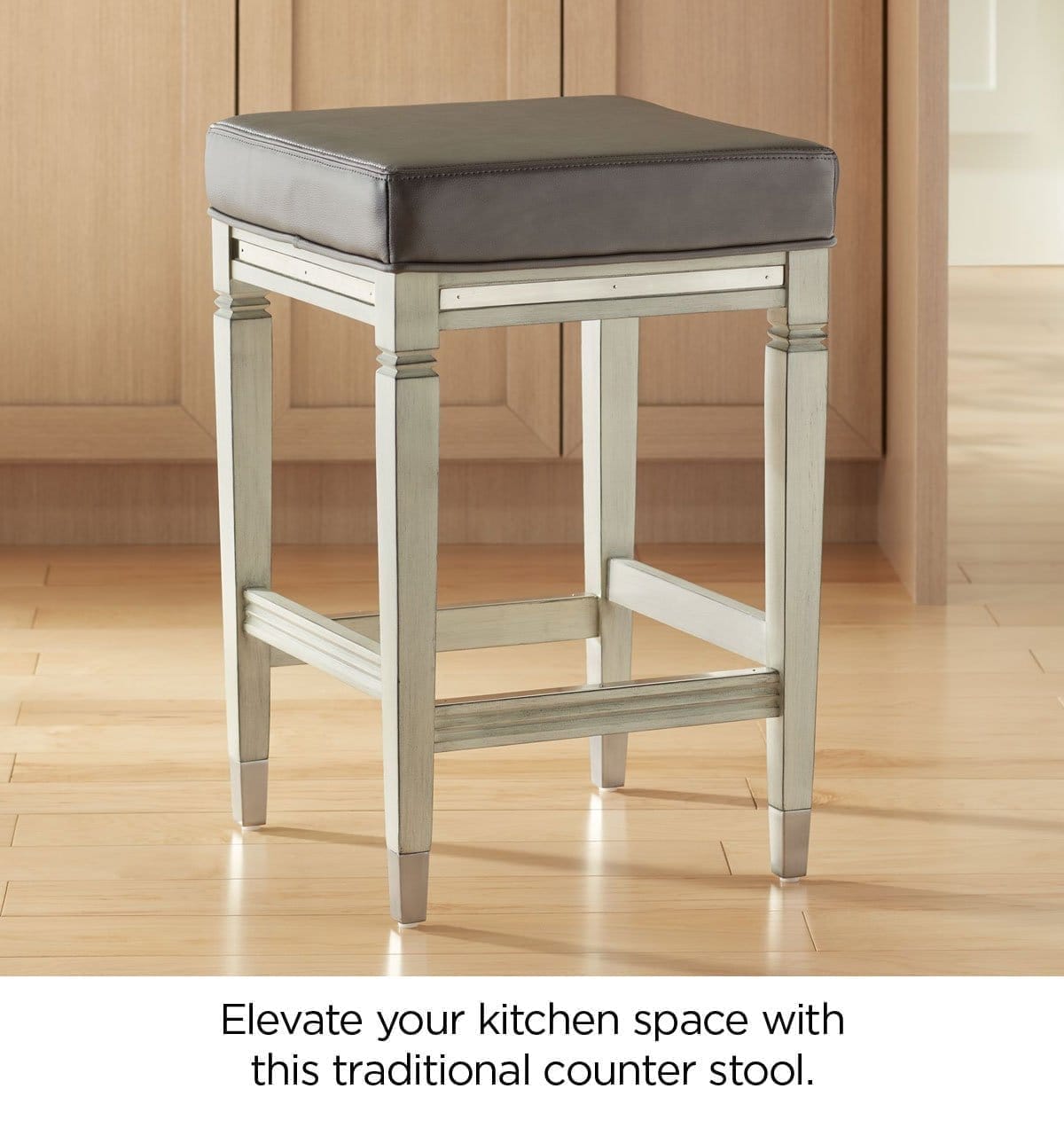 Elevate your kitchen space with this traditional counter stool.