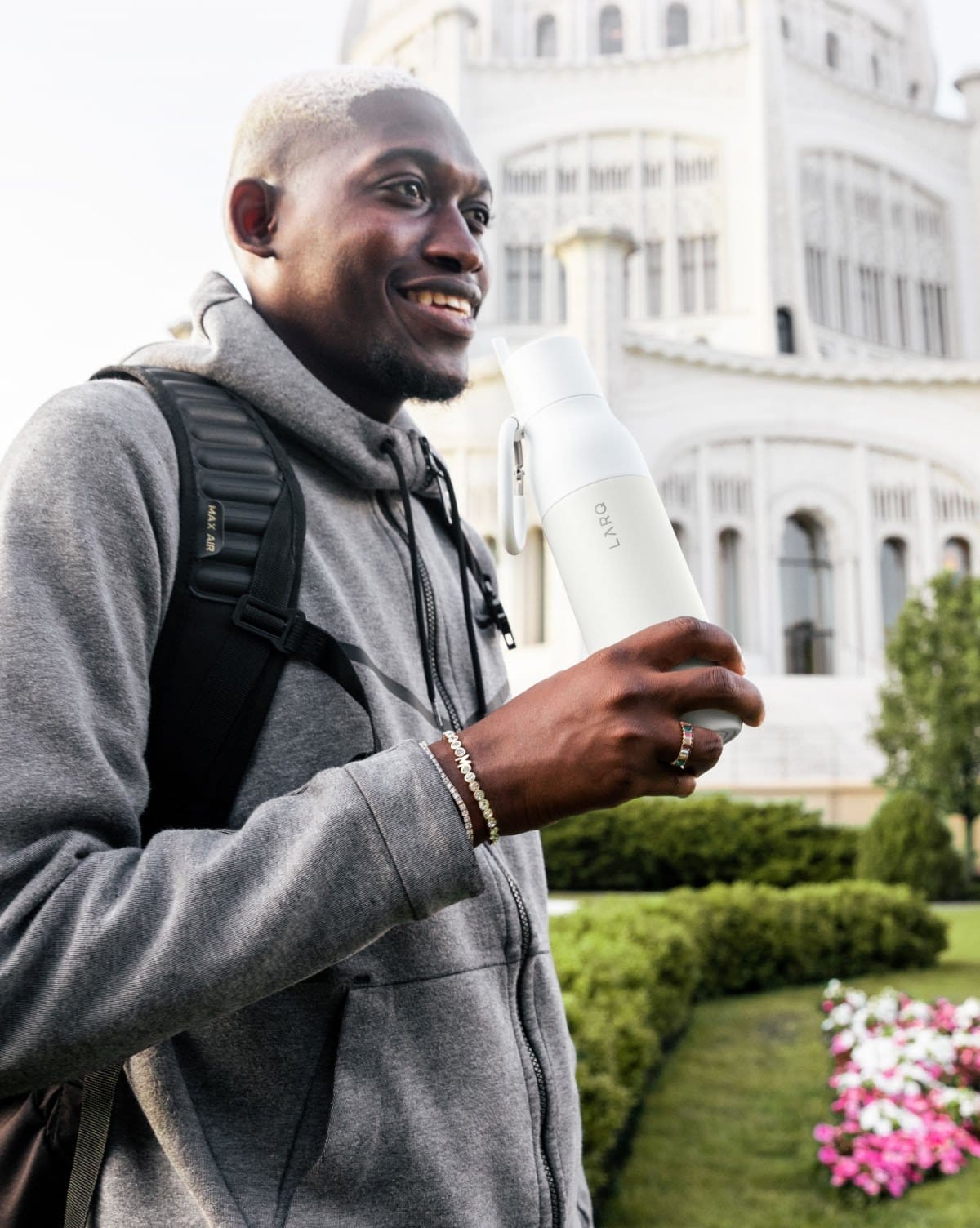 Man holding white bottle filtered