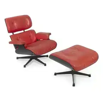 A red leather and ebonised Eames lounge chair and ottoman