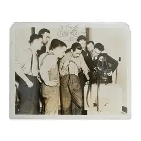 Walt Disney Signed Photo - 'Looking at film' - Brown Brothers NY Photo