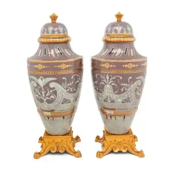 A Pair of Continental <br>Pâte-sur-Pâte Porcelain and Gilt-Bronze Mounted Covered Urns