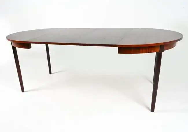 MANNER OF KAI KRISTIANSEN ROSEWOOD DINING TABLE