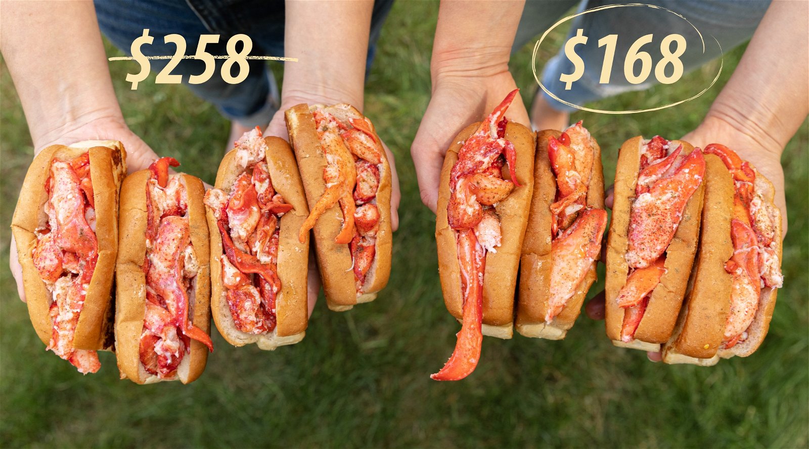 Two people holding 8 lobster rolls