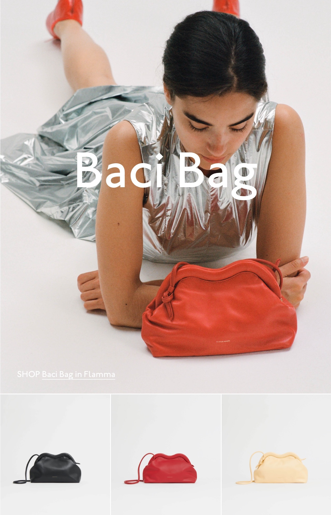 The Baci Bag, crafted from soft Italian lambskin leather, features a smooth, curved clasp inspired by the shape of lips. Pictured: Baci Bag in Flamma red. 