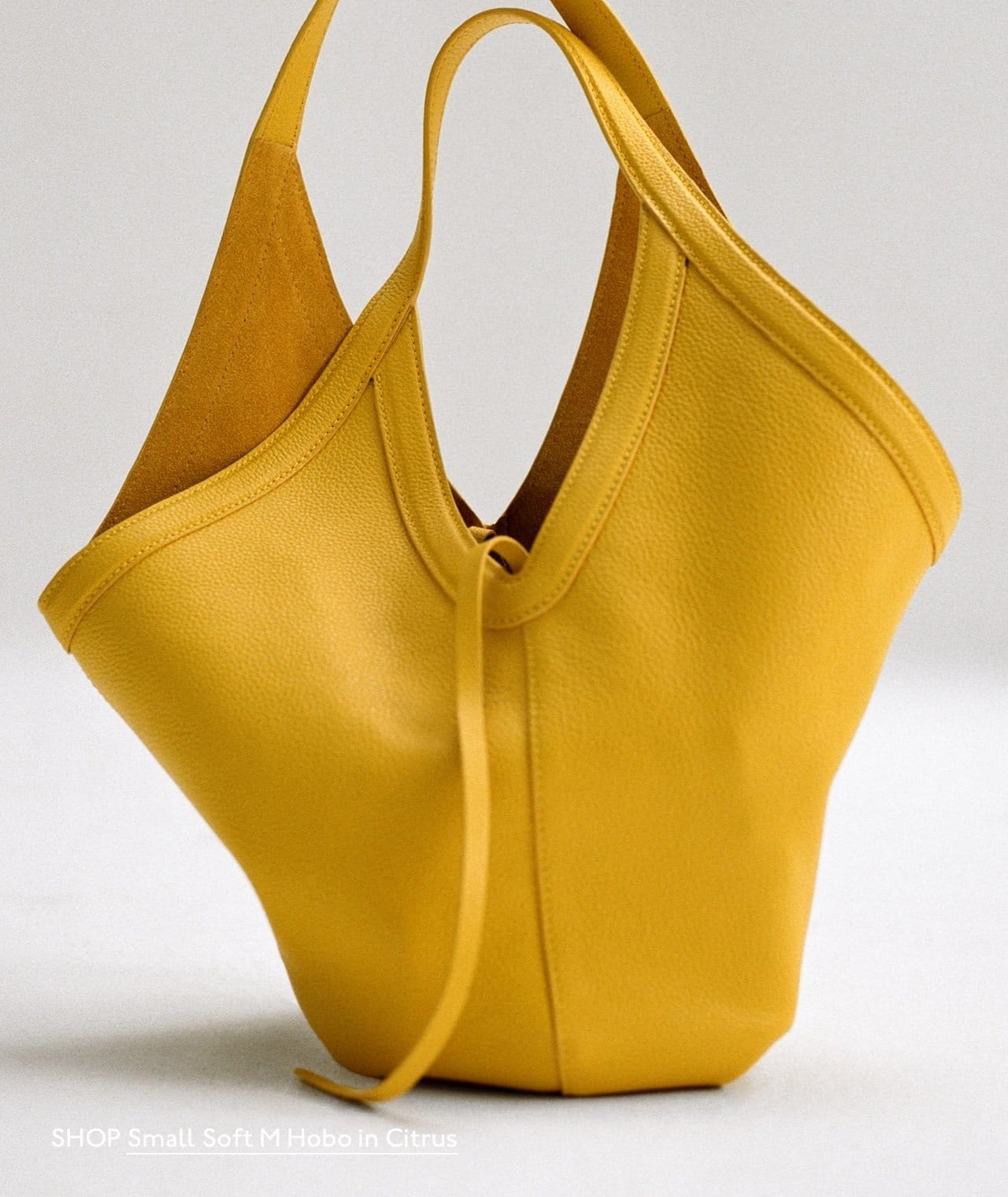 Shop yellow, our favorite color. Pictured: the Small Soft M Hobo in Citrus.