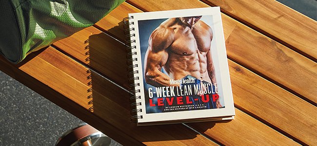 6-Week Lean Muscle Level-Up guide laying on a bench with weights nearby