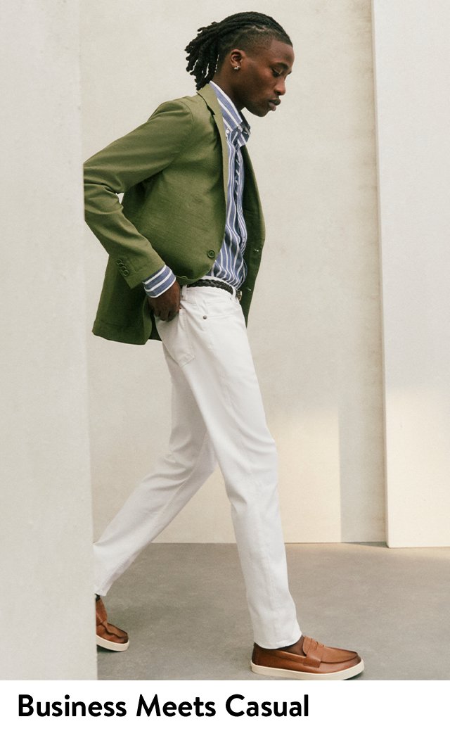 Model wearing green sport coat, blue-and-white striped shirt, white jeans and brown loafers.