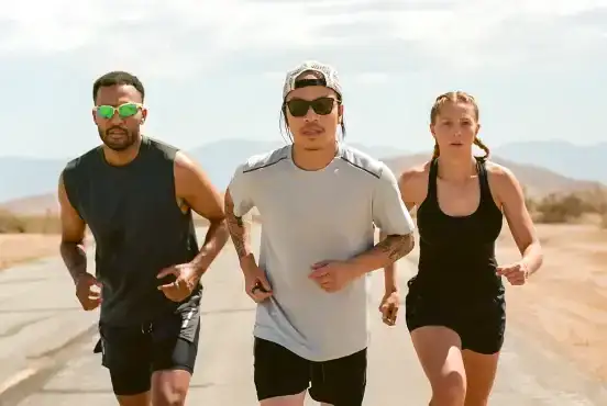 Three people running towards the Camera wearing Oura Rings
