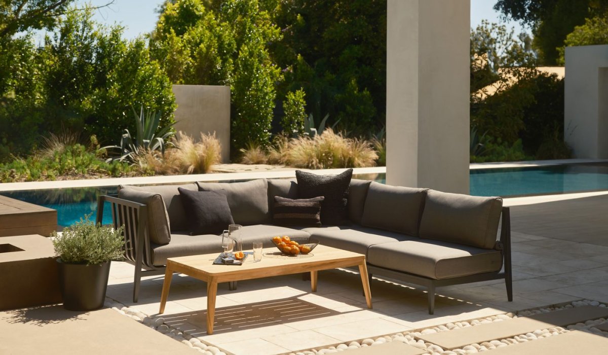 Spacious Yards Transform large outdoor spaces with an extended sofa or L-shaped sectional, complemented by armchairs and a central coffee table. This layout provides a relaxed and inviting atmosphere, ideal for hosting gatherings of any size.