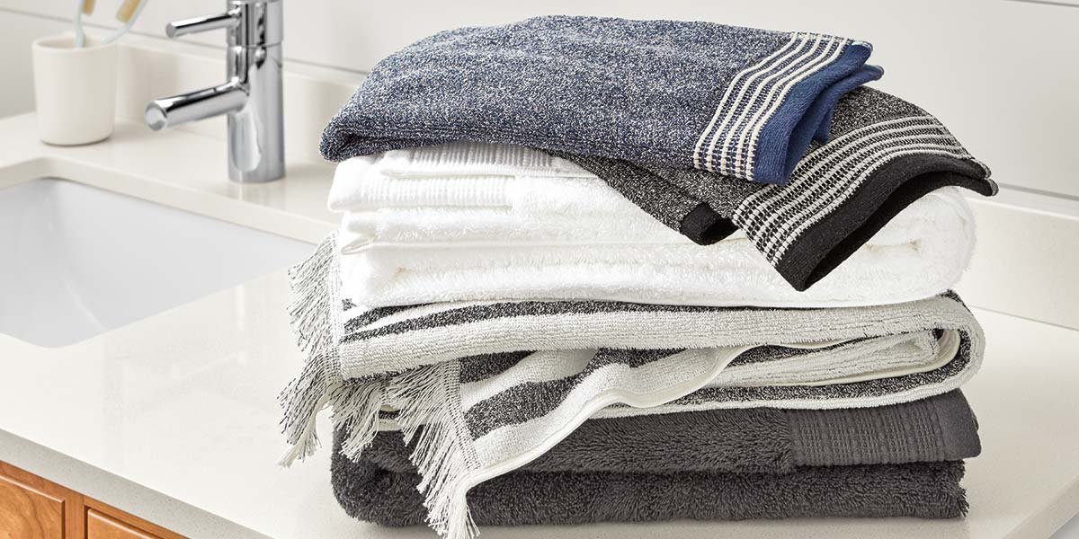 Stack of bath towels on a bathroom vanity