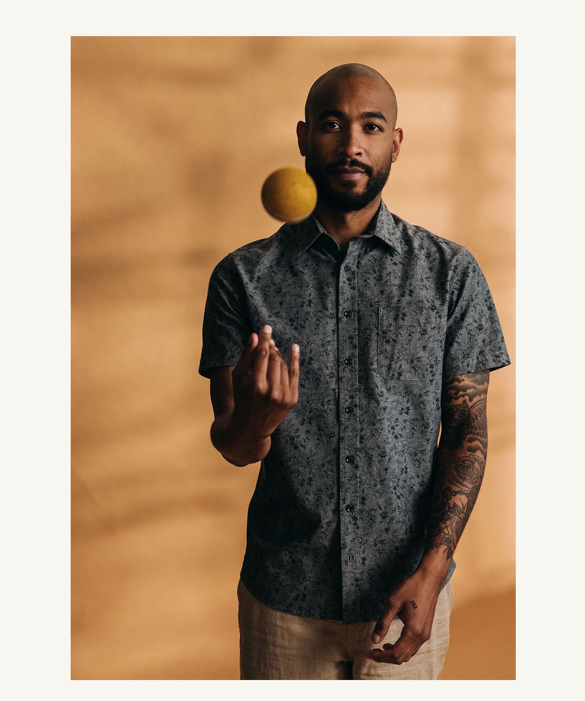 Fit model posing in The Short Sleeve California in Blue Chambray Botanical