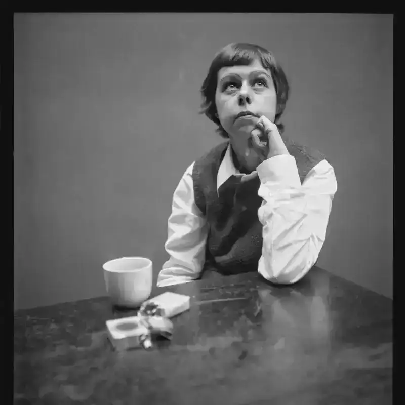 Image may contain: Carson McCullers, Body Part, Finger, Hand, Person, Cup, Photography, Face, Head, Portrait, and Beverage