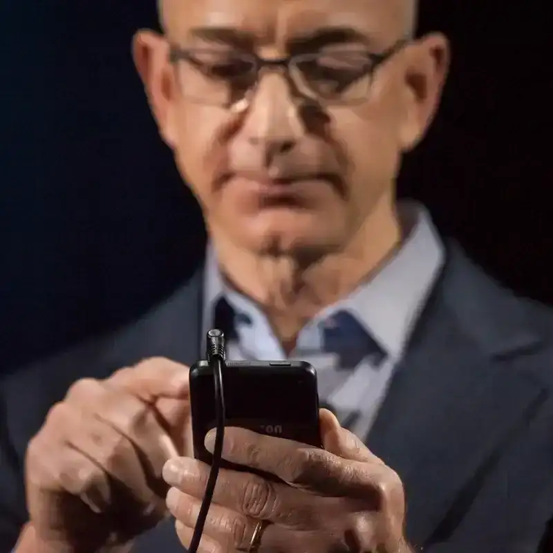 Jeff Bezos Types on a Smartphone