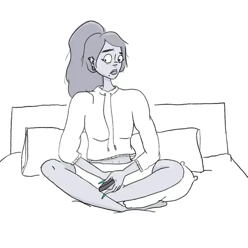 Woman sitting on bed.