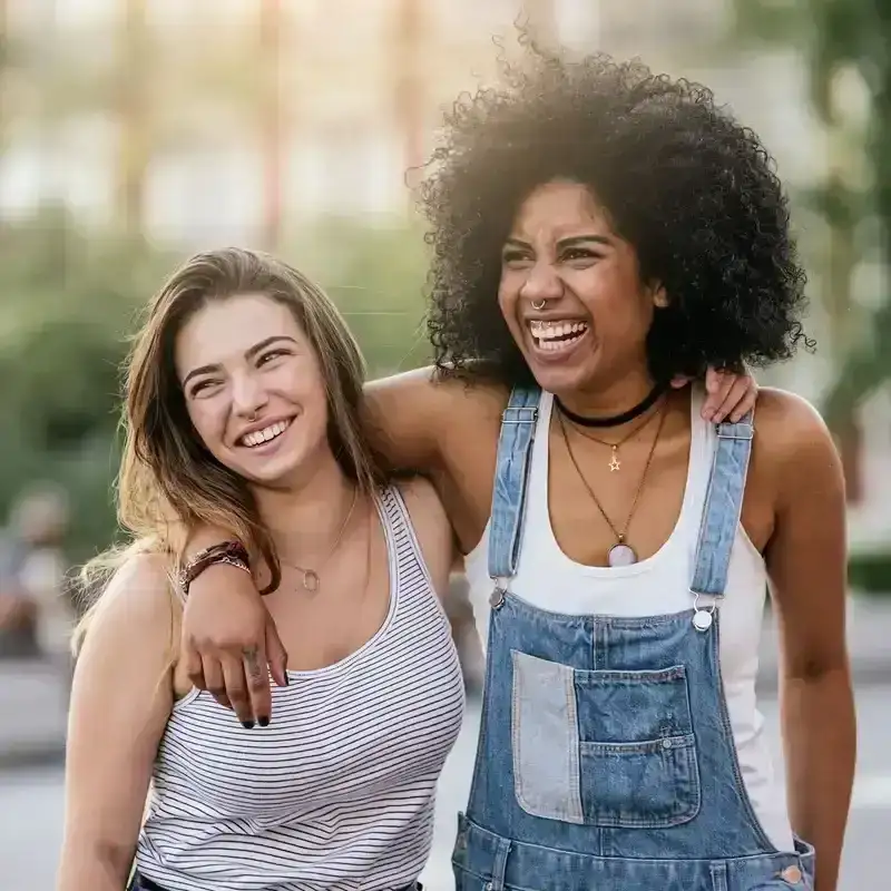 Two women with their arms around each other.