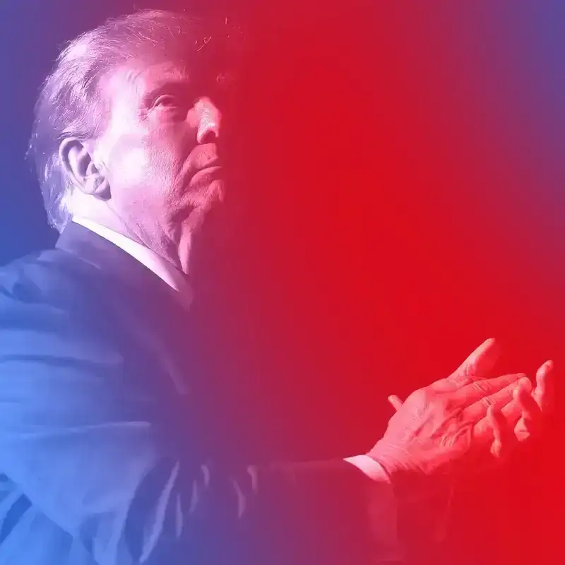 Former U.S. President Donald Trump at a speaking event. He is looking up with hands clasped, about to clap. There is a blue and red treatment on the image. 