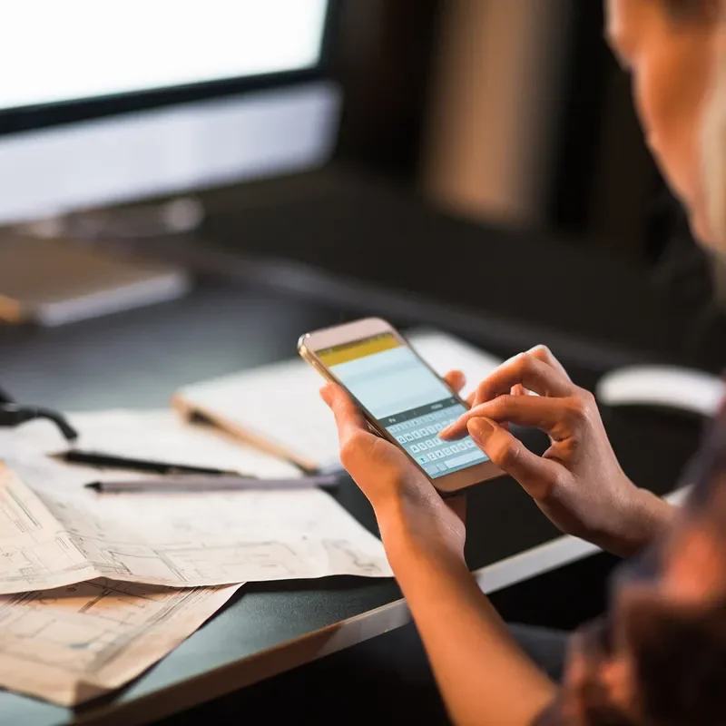 Woman e-mailing on a smart phone