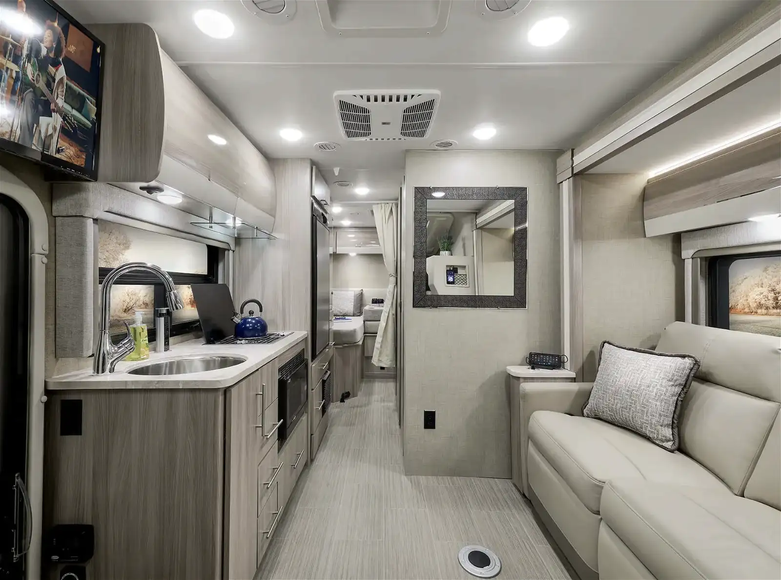 Interior of an RV with a kitchen and sofa