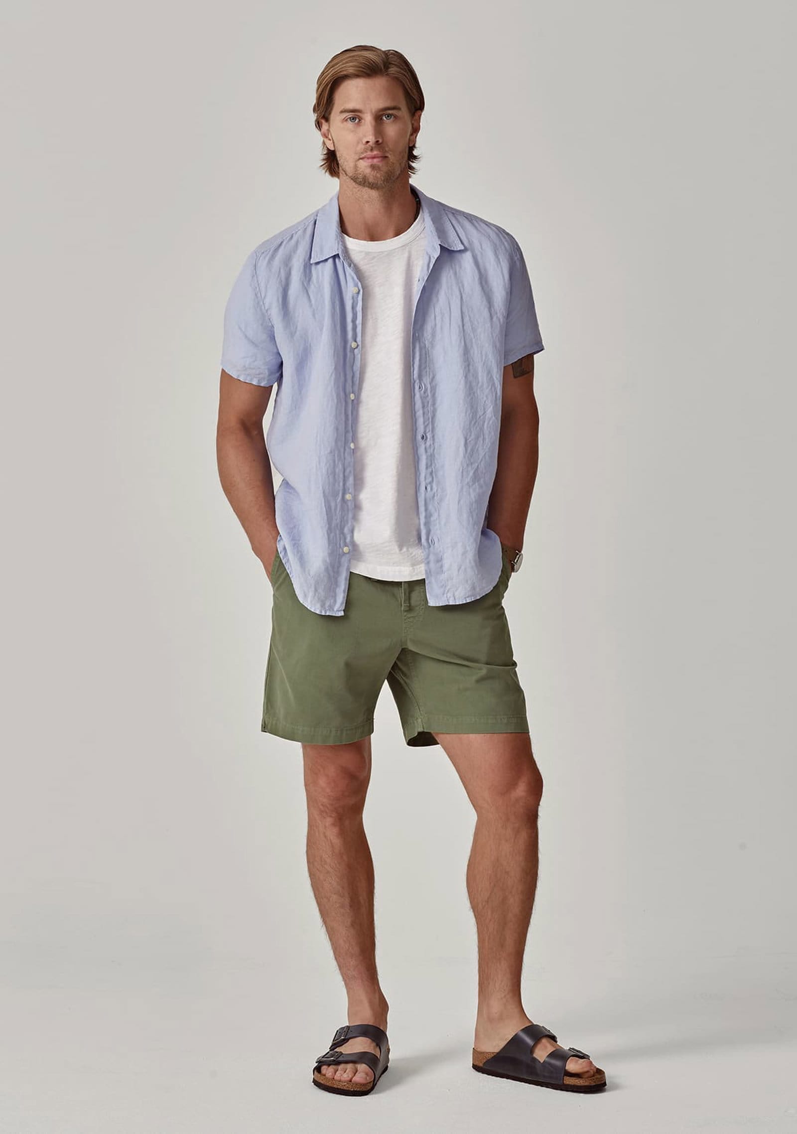 Model wearing the Mackie Linen Button-Up Shirt and Fielder Short