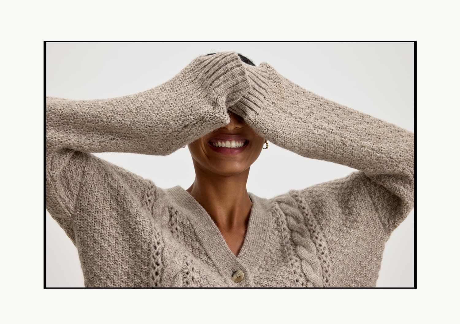 Model wearing the Izzy Cardigan in Oat