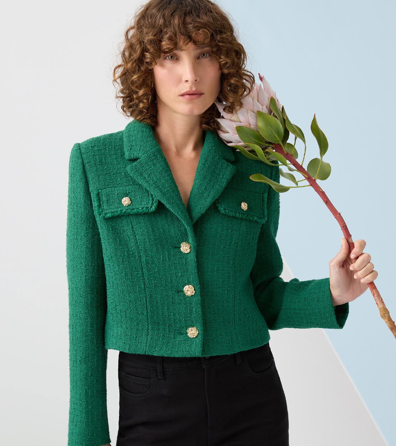 Hero image. Model is wearing European Tweed Crop Jacket in Deep Green.