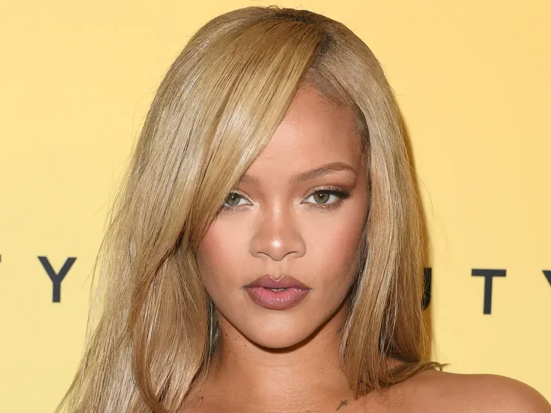 Image may contain: Rihanna, Blonde, Hair, Person, Adult, Head, Face, Photography, and Portrait