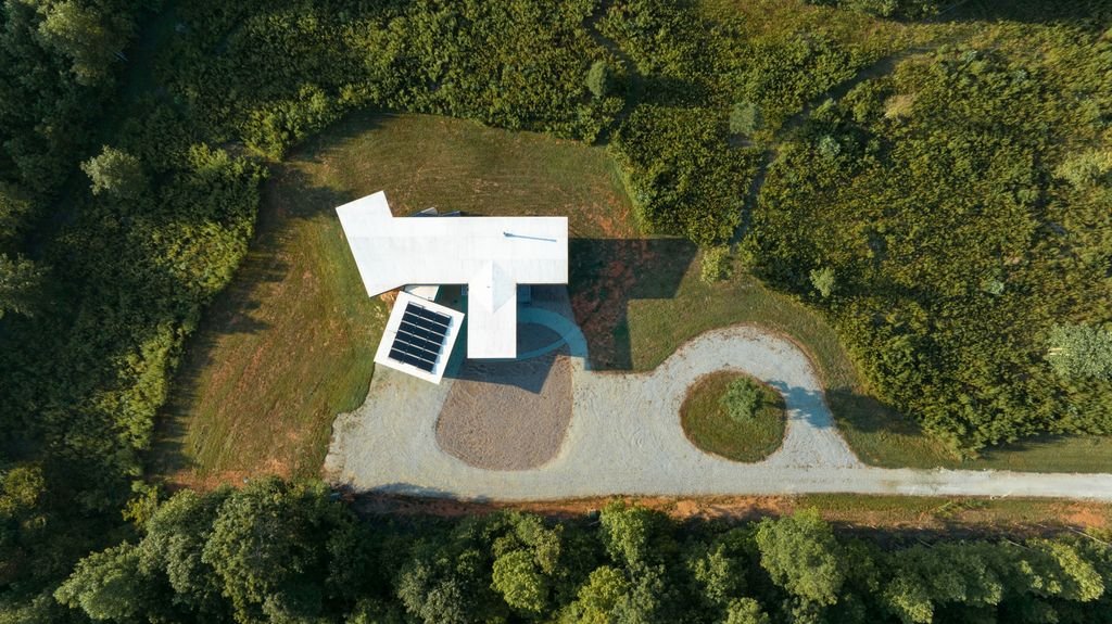 white building amid nature from above