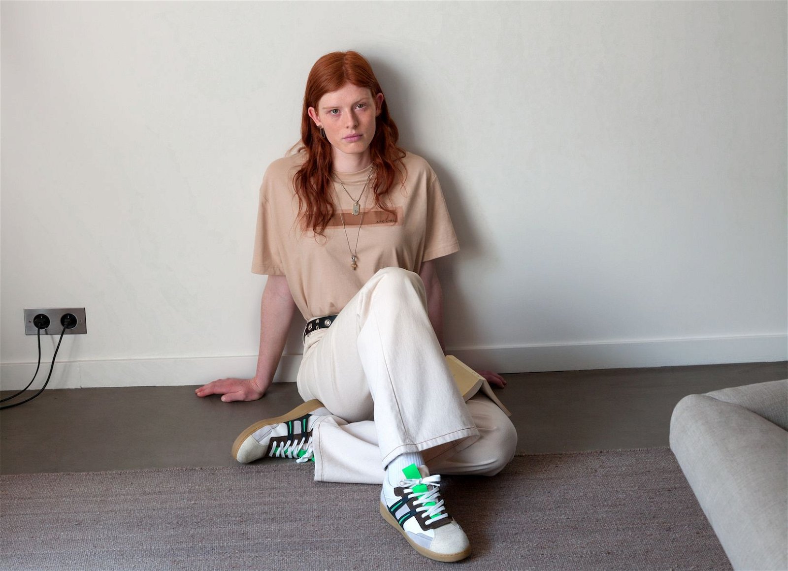 red-haired woman in jeans and T shirt